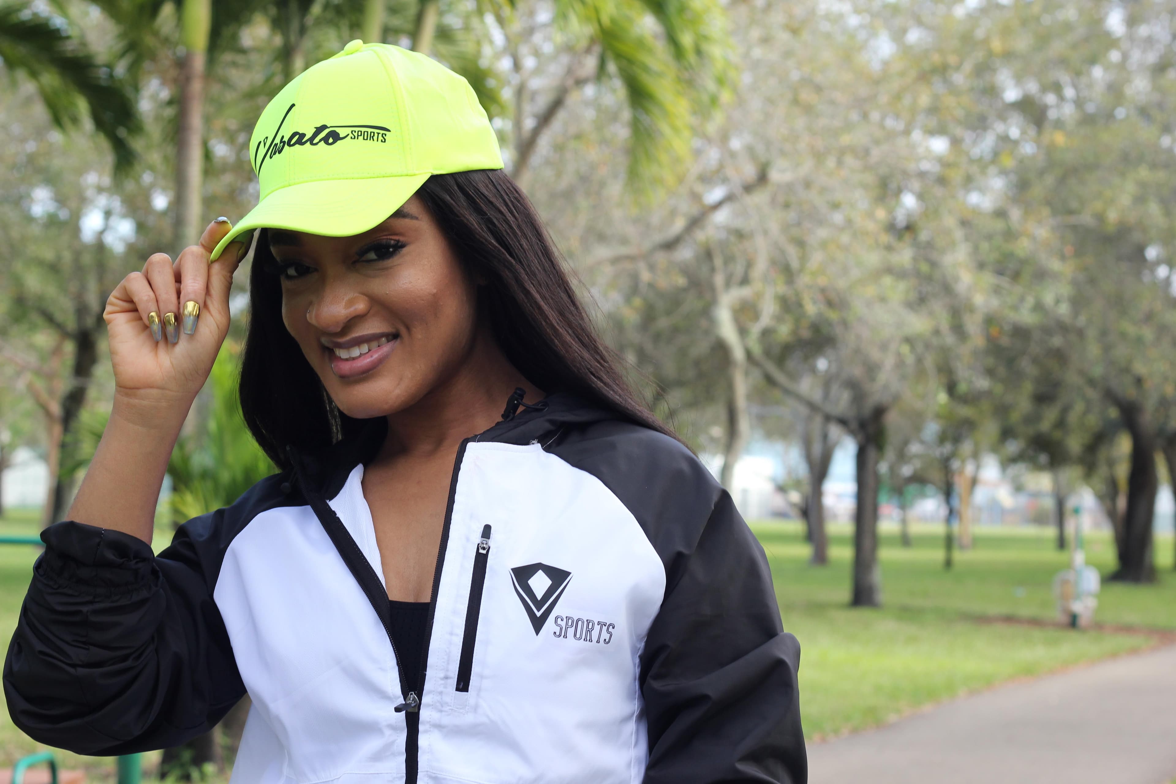 Olatunde wearing Vasato sportswear in a park